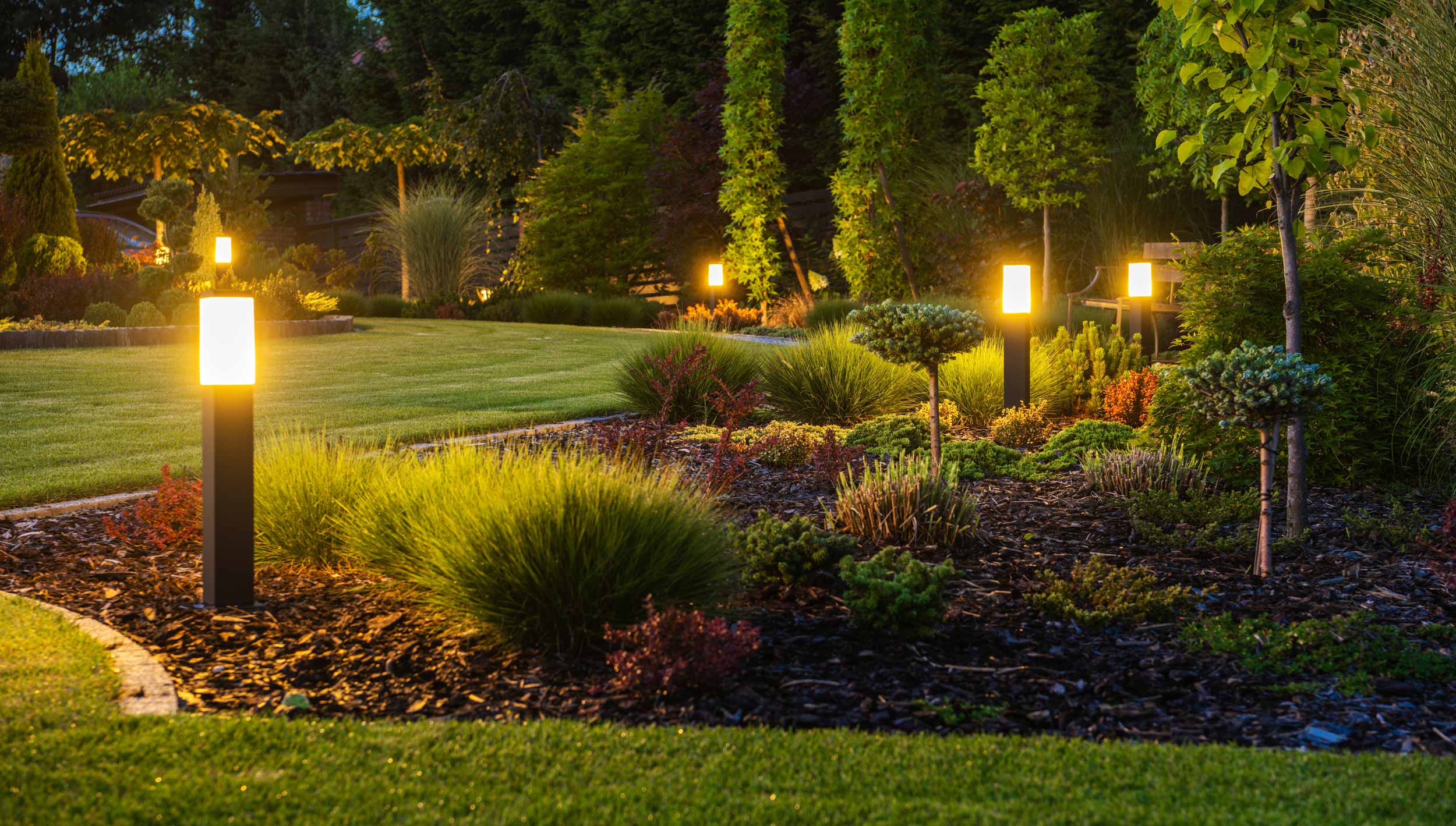 Illuminate Your Outdoor Oasis: A Guide to Exterior Landscape Lighting with Executive Green